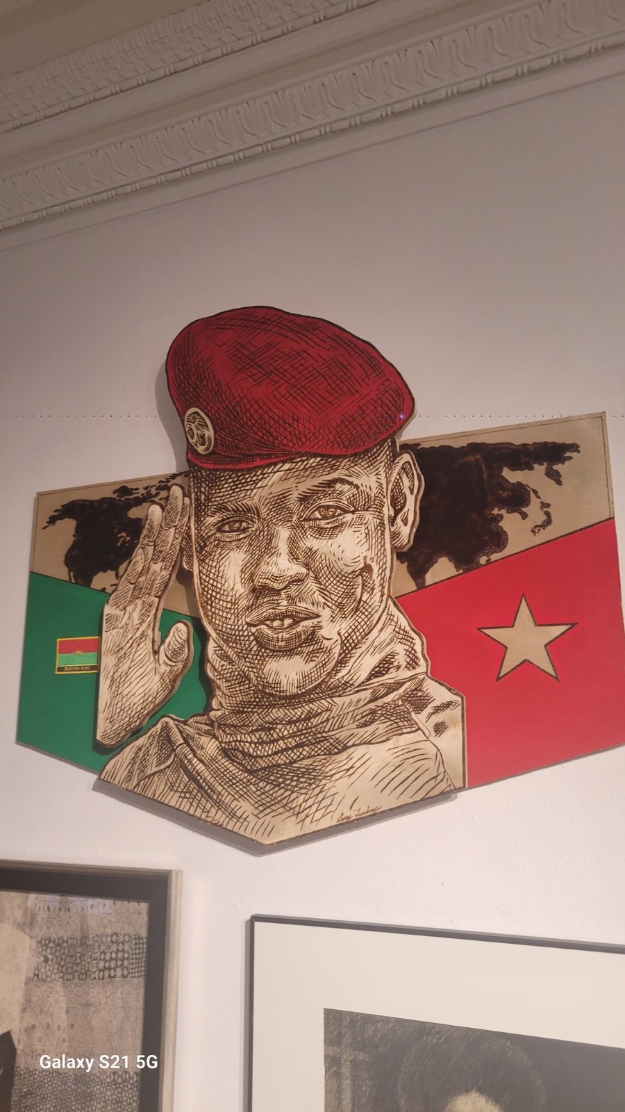 Pyrography portrait with red beret on flag panels